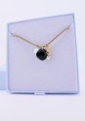 Collier Éclat Obscur en obsidienne noire, bijou au style minimaliste.