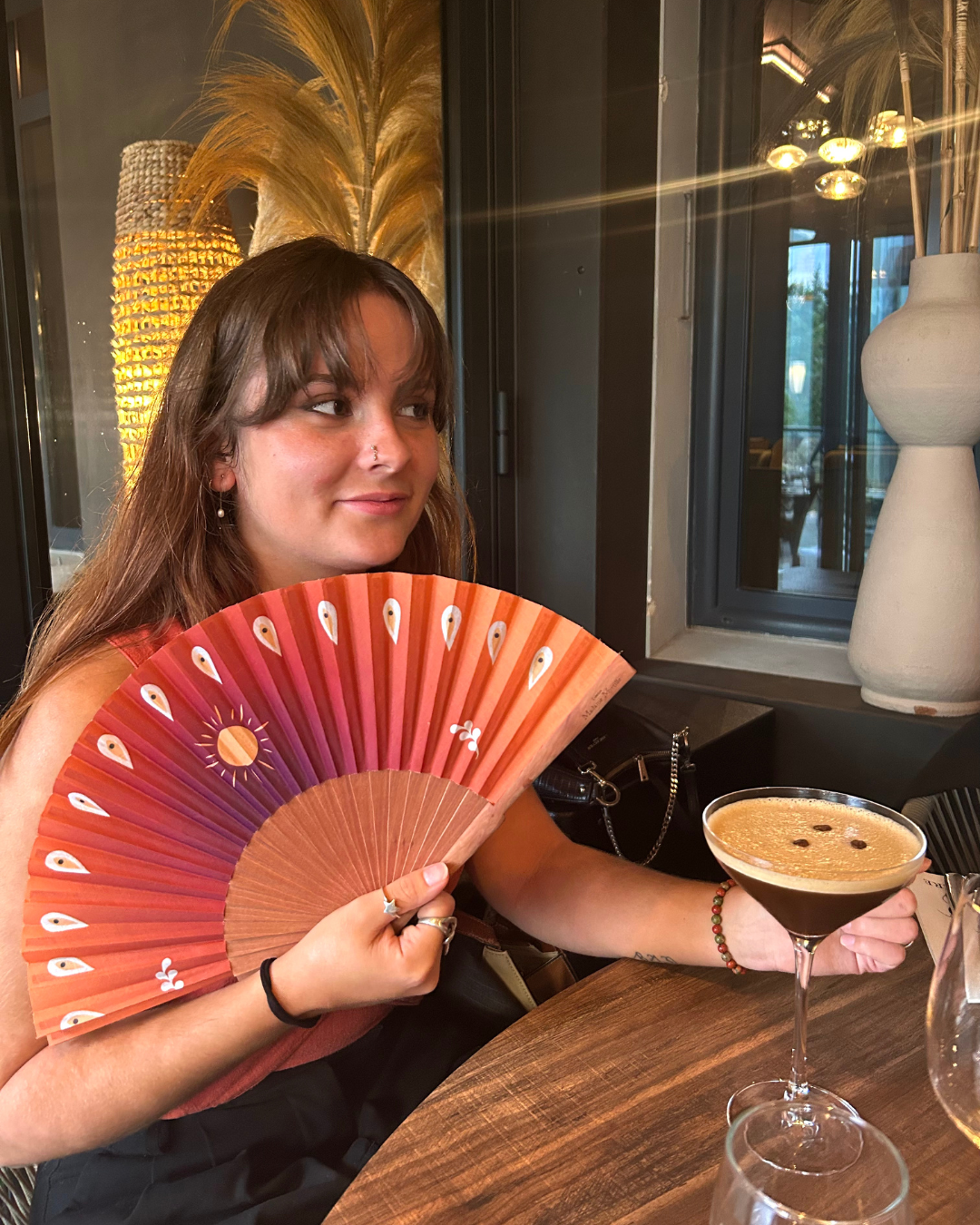 éventail artisanal orange motif soleil style bohème